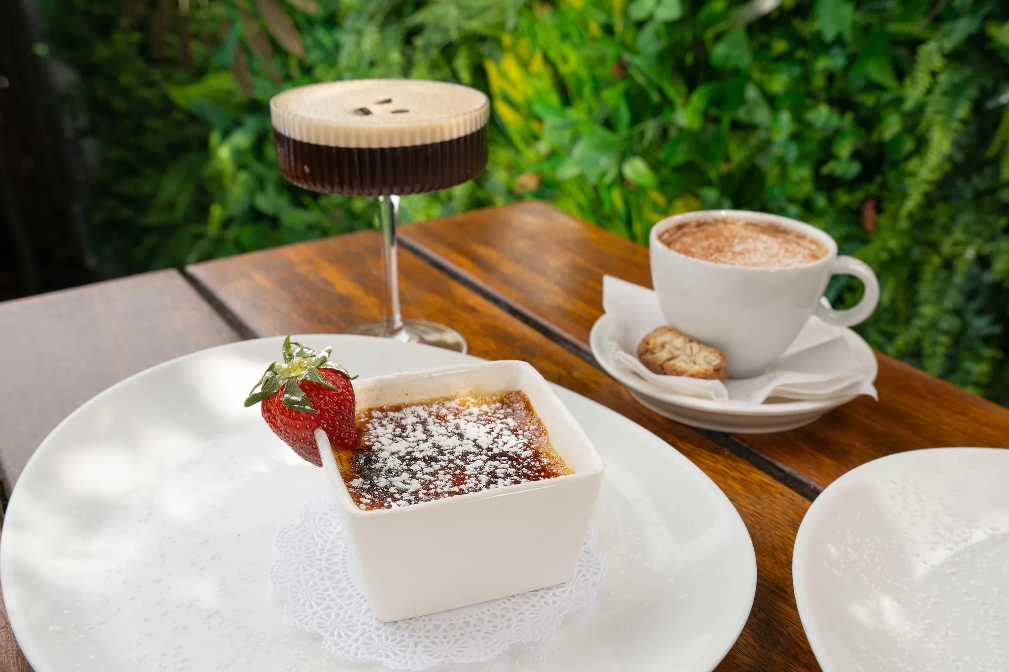 Dessert, coffee, and cocktail on table